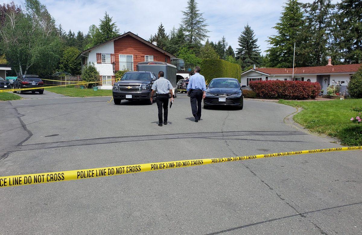 Investigators at the scene of a home in Brentwood Bay outside Victoria, B.C., where one person was killed and two more sent to hospital. Saturday, May 11, 2019.