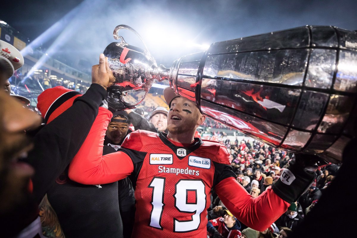 Calgary Stampeders quarterback Bo Levi Mitchell hoists the Grey Cup after defeating the Ottawa Redblacks in the 106th Grey Cup CFL championship football game in Edmonton, Alta., on Sunday November 25, 2018.