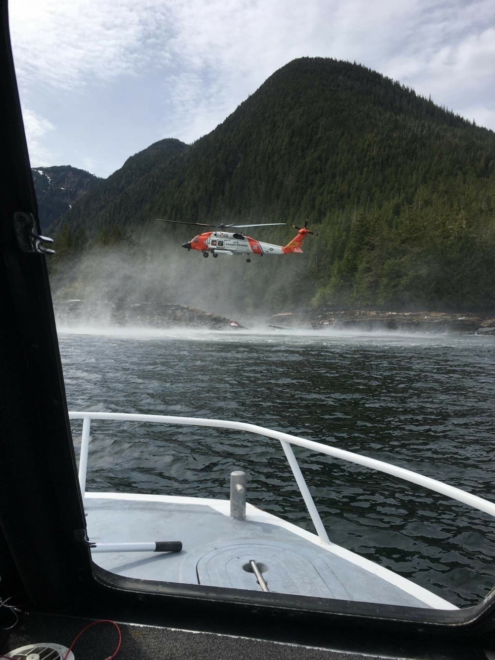 The U.S. Coast Guard on the scene of a fatal float plane crash near Ketchikan, Alaska on Monday.