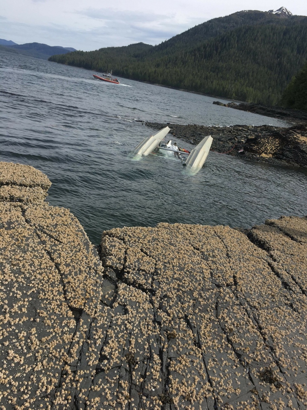The scene of a fatal float plane crash that left at least four people dead and two unaccounted for near Ketchikan, Alaska, on May 13, 2019.