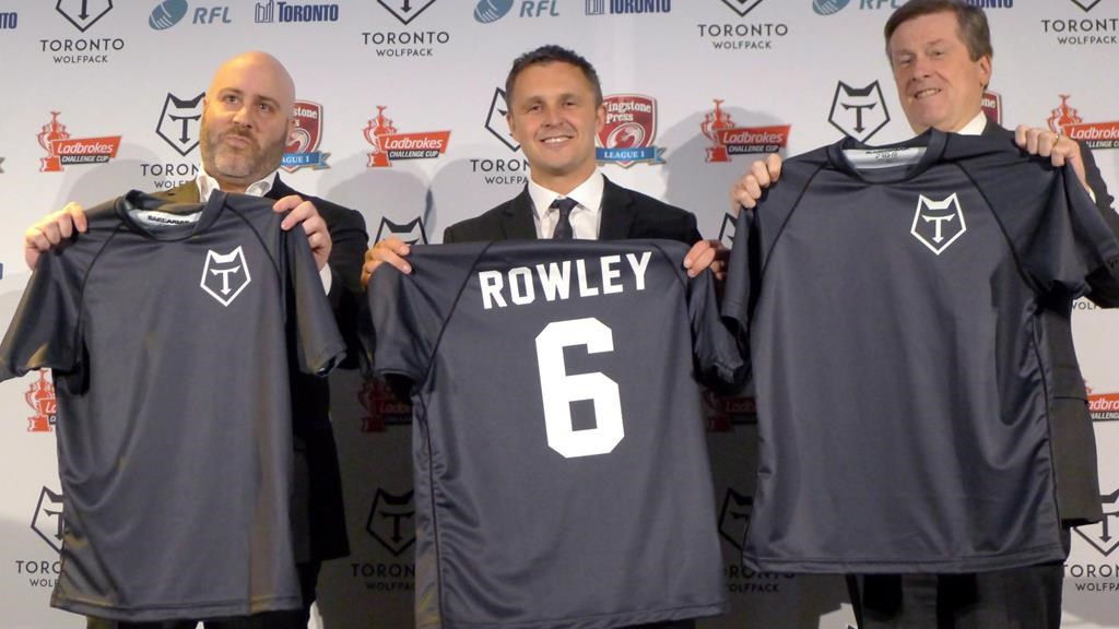 Eric Perez, the founder and CEO of the Toronto Wolfpack (left), Wolfpack head coach Paul Rowley and Toronto Mayor John Tory hold up jerseys of the new rugby league team in Toronto, Wednesday, April 27, 2016. The governing body of English rugby league has accepted a bid to put a franchise in Ottawa. Perez, who helped bring the sport to North America via the Wolfpack, is part of a Canadian consortium that acquired England's Hemel Stags team in the hope of moving it to Ottawa.