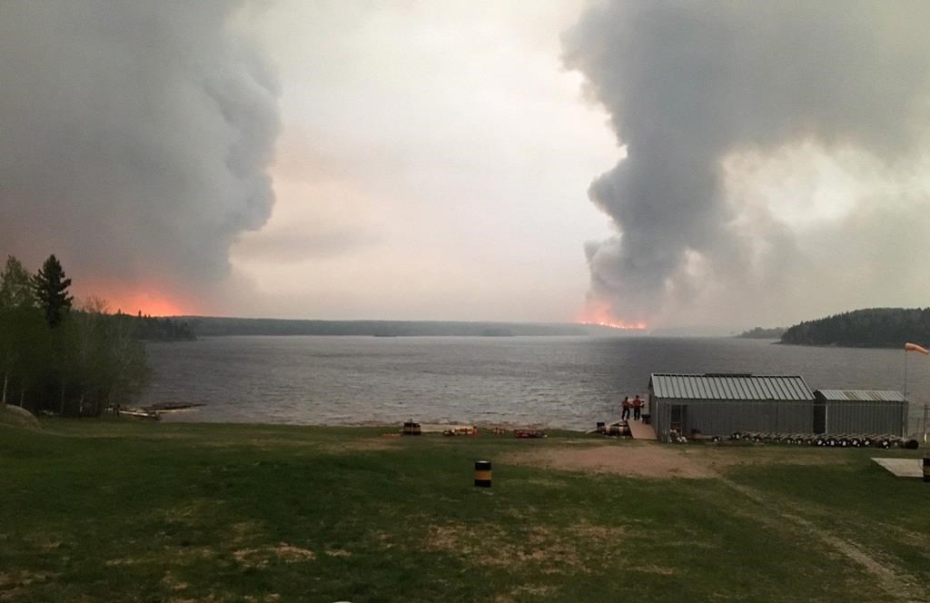 Fires burn in Little Grand Rapids, Man., as shown in a 2018 Government of Manitoba handout photo. THE CANADIAN PRESS/HO - Government of Manitoba.