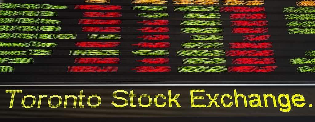File - Financial numbers flow on the digital ticker tape at the TMX Group in Toronto's financial district on May 9, 2014.