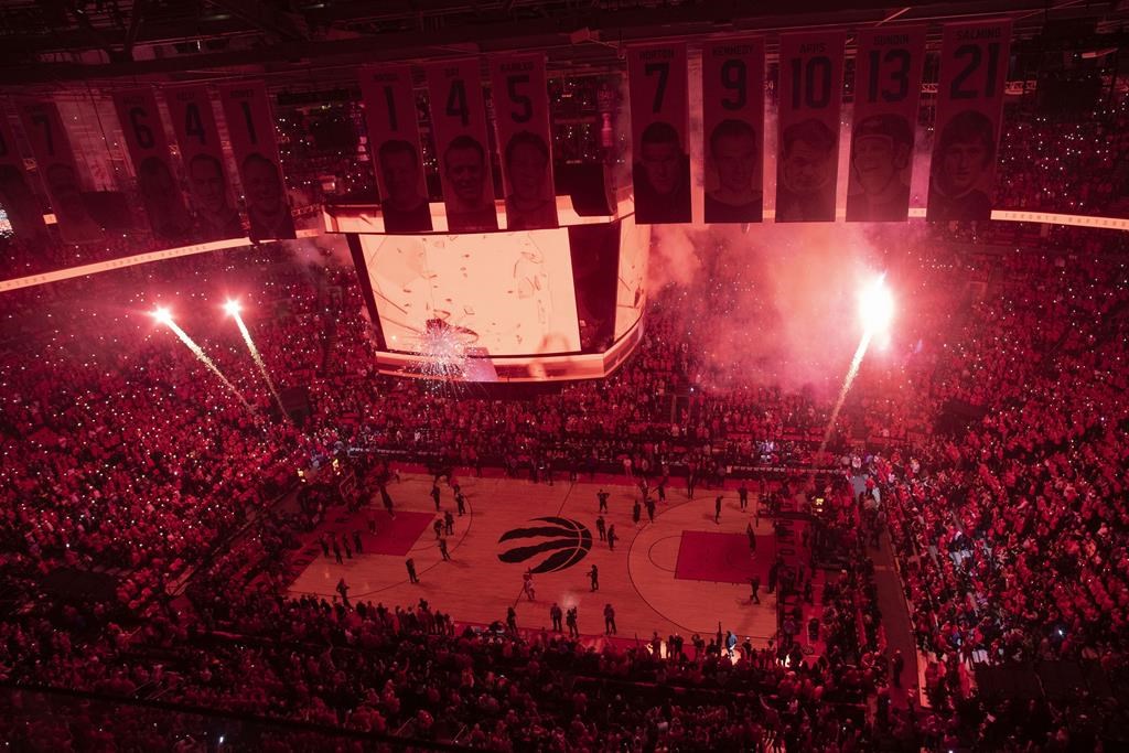 Pyrotechnics illuminate the court before first half NBA Eastern Conference finals action between the Toronto Raptors and the Milwaukee Bucks, in Toronto on Saturday, May 25, 2019.
