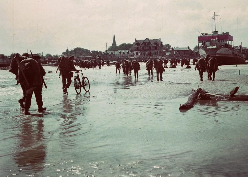 Canadian soldiers land on a Normandy, France beach during the D-Day invasion June 6, 1944. THE CANADIAN PRESS/Department of National Defence, *MANDATORY CREDIT*.