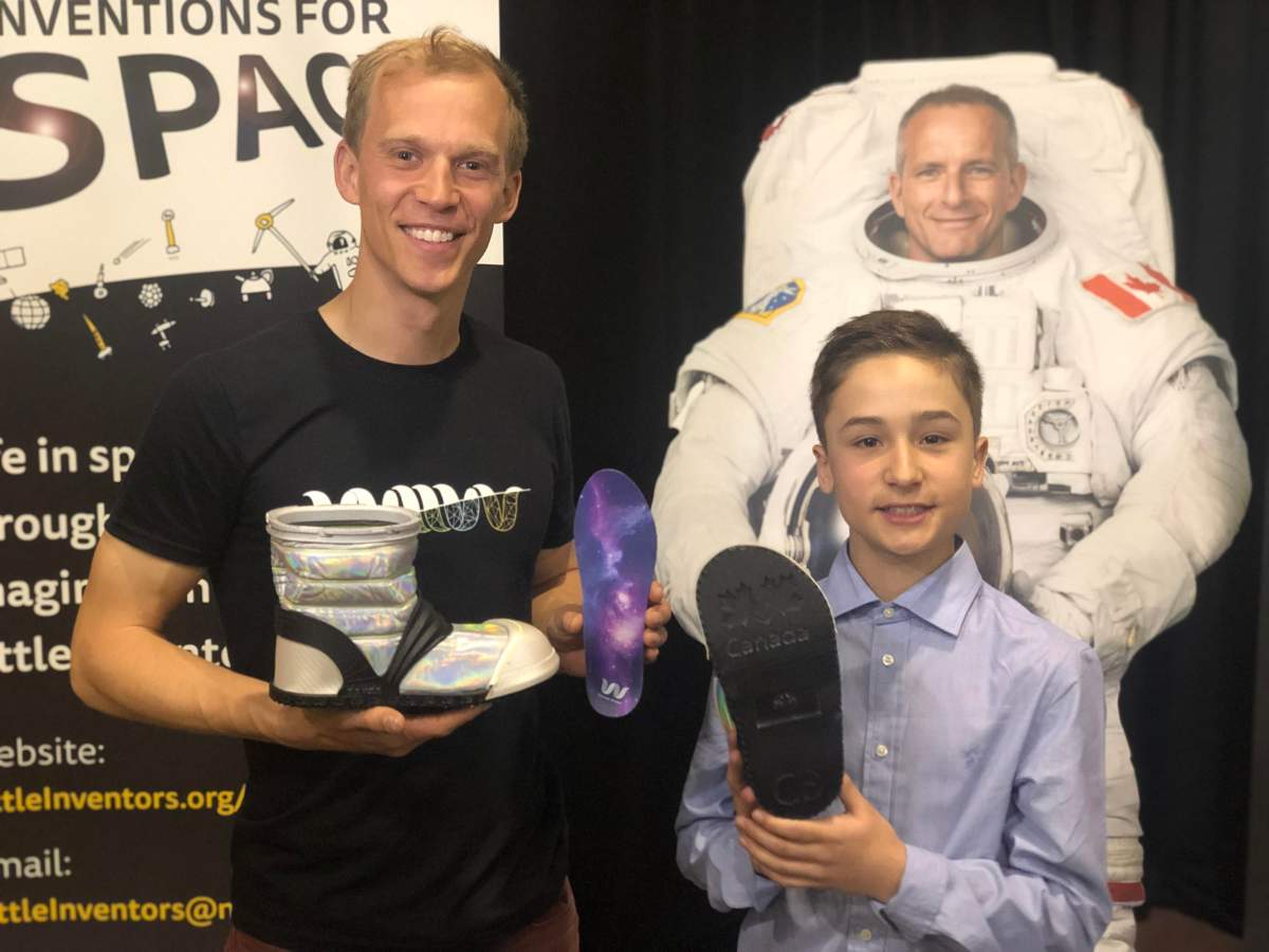 Chris Bellamy poses for a photo with Connor Brown, winner of Little Inventors: Inventions for Space