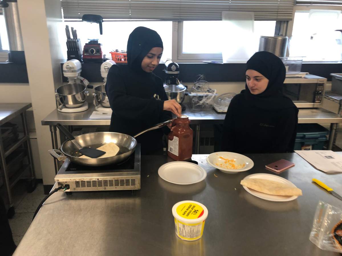 Students participates in the cooking for one workshop, as part of adulting courses at E.J. Lajeunesse catholic high school.