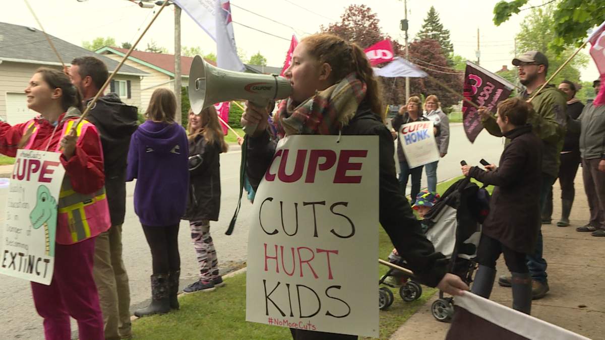 Support workers protest education cuts leading to layoffs.