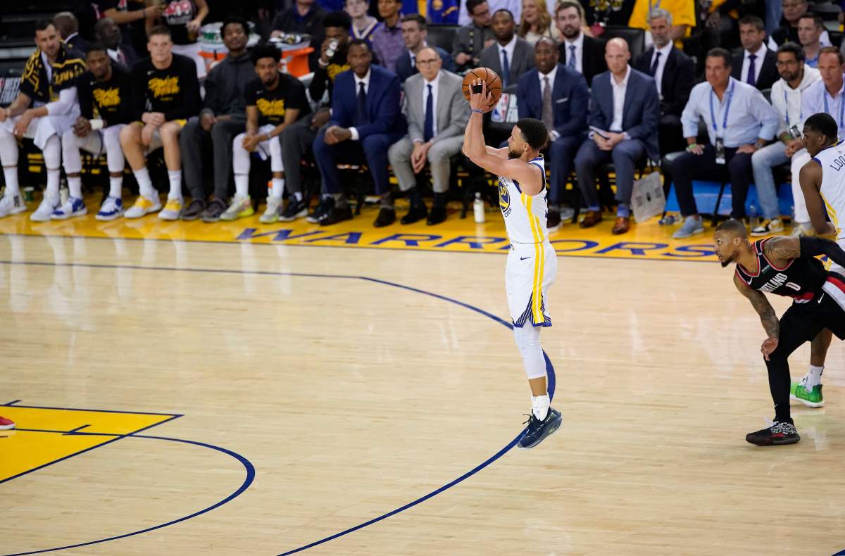 Golden State Warriors guard Stephen Curry (C) shoots for three points during the NBA Western Conference playoff finals game one between the Portland Trail Blazers and the Golden State Warriors at Oracle Arena in Oakland, California, USA, 14 May 2019.