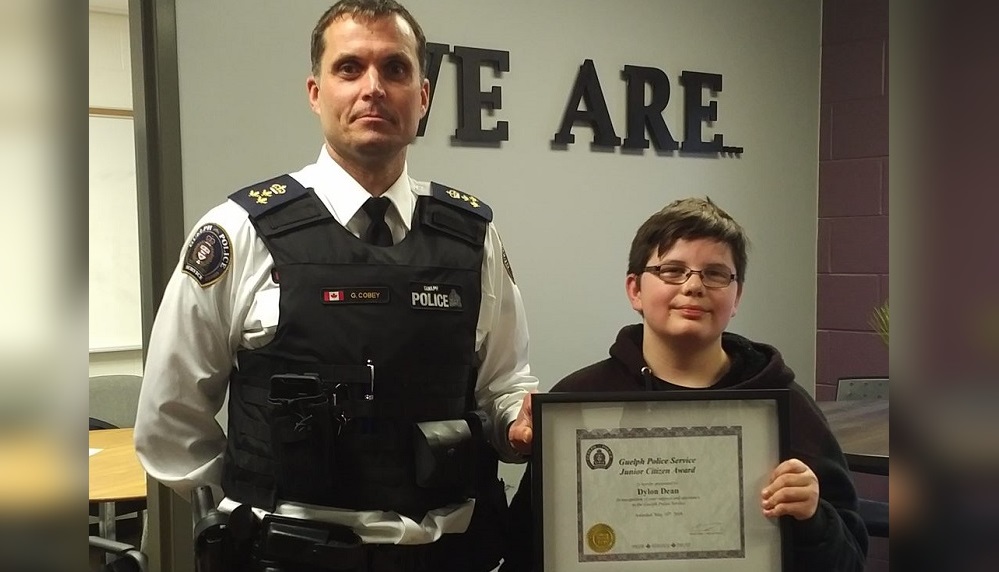 Guelph police Chief Gord Cobey with Dylon Dean and his Junior Citizen Award.