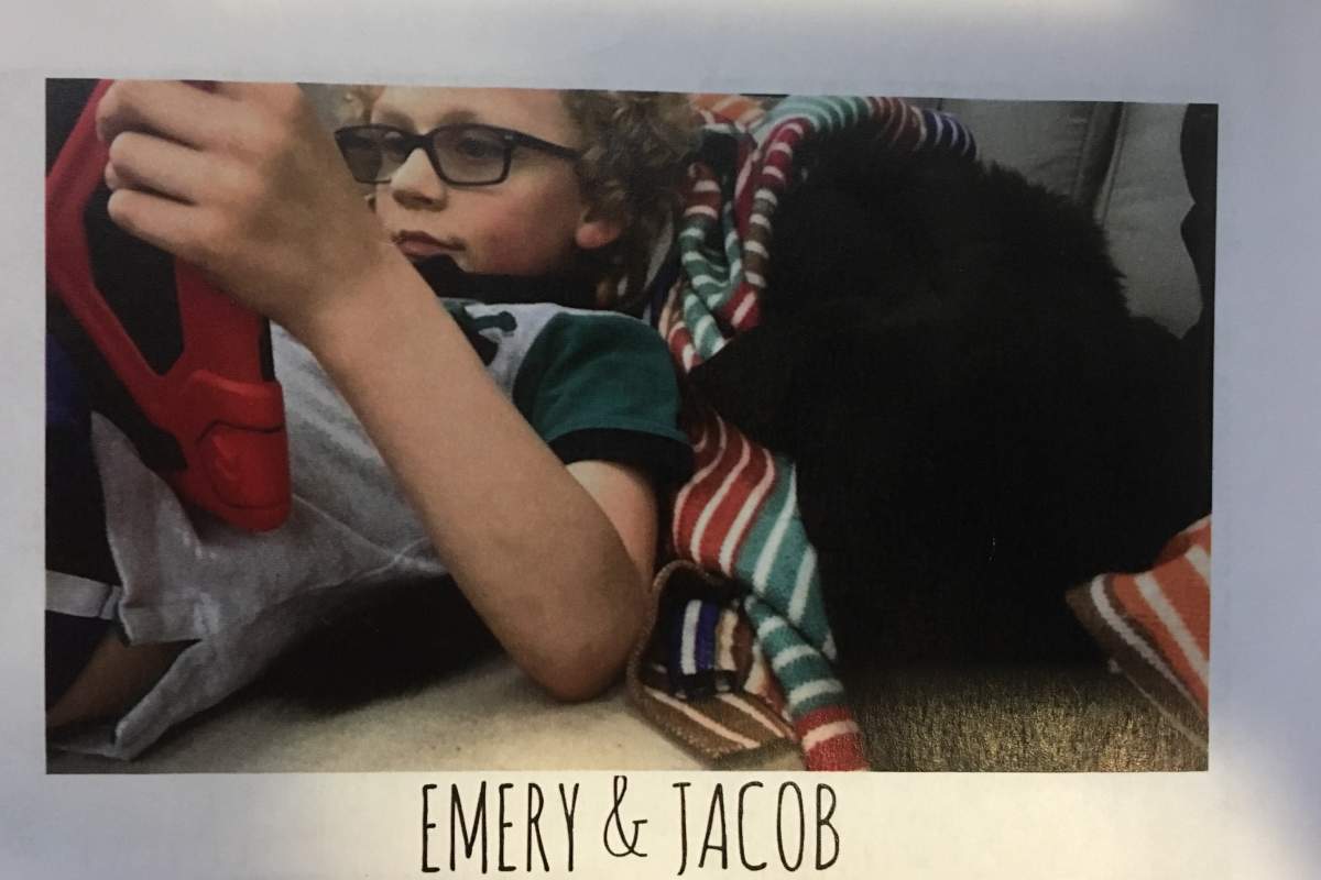 Emery Spanik and his service dog, Jacob, enjoy some screen time together at the family home in Halifax.