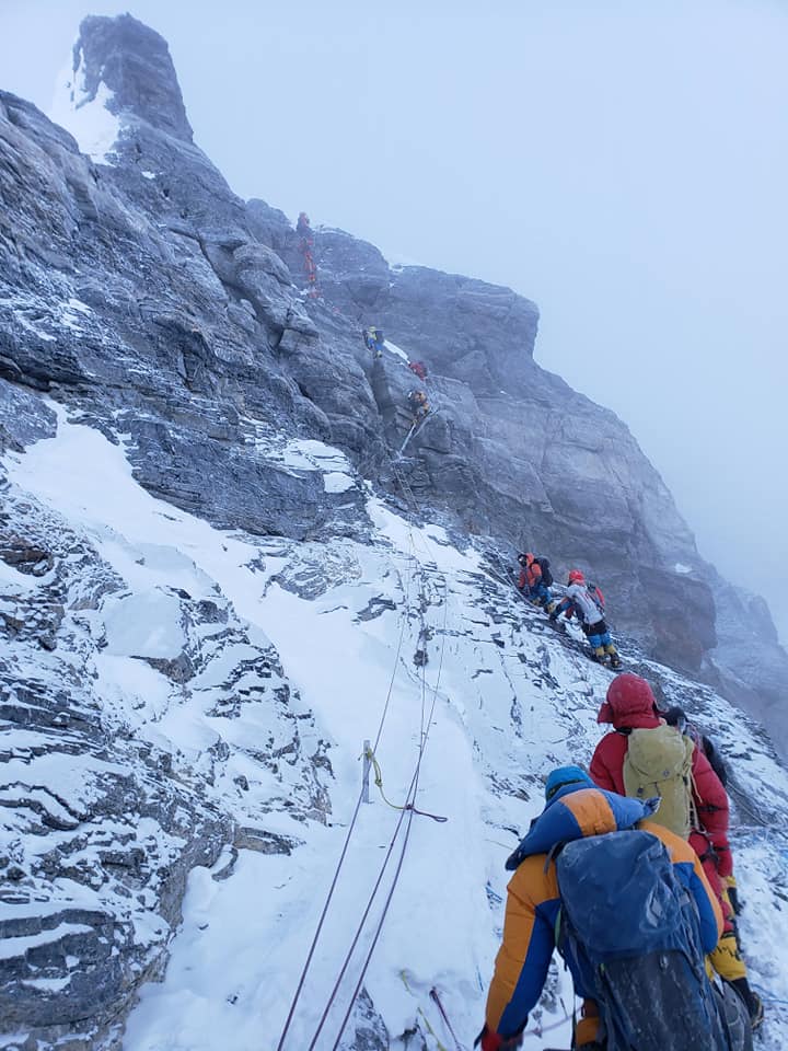 Climbers lined up at the narrow second step of the final push to the Everest summit.