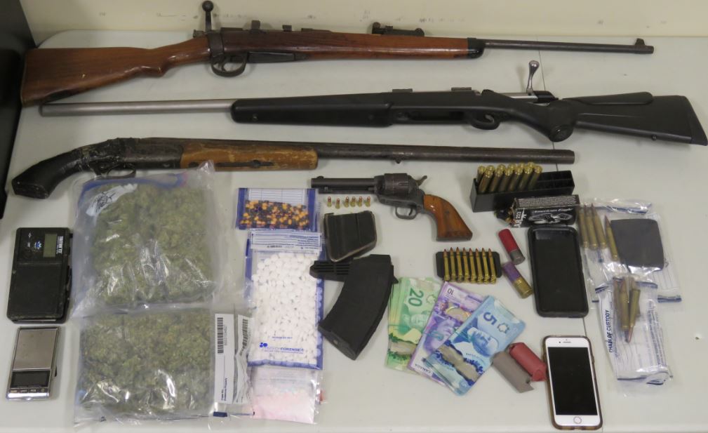 Police seized drugs, cash, a firearm and ammunition. 