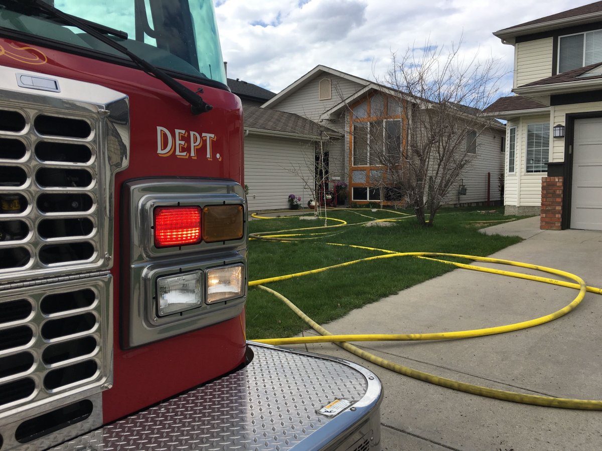 Calgary fire crews on scene of a house fire in the community of Citadel on Monday.