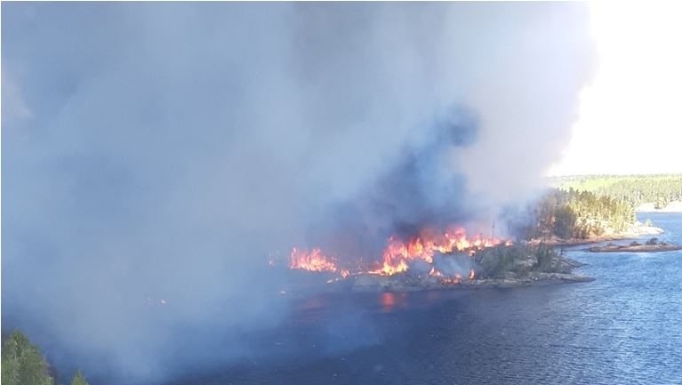 A forest fire burns near Pauingassi First Nation in Manitoba.
