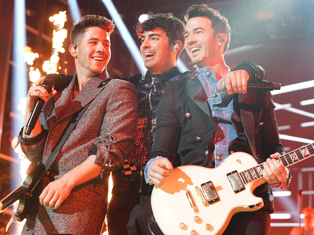 (L-R) Nick Jonas, Joe Jonas and Kevin Jonas performing live onstage in 2019.