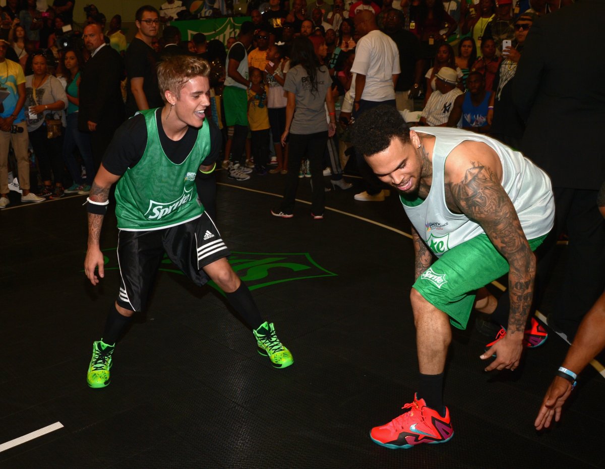 Justin Bieber (L) and Chris Brown attend the Sprite Celebrity Basketball Game during the 2014 BET Experience At L.A. LIVE on June 28, 2014 in Los Angeles, Calif.