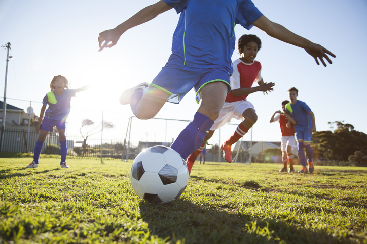Youth playing soccer