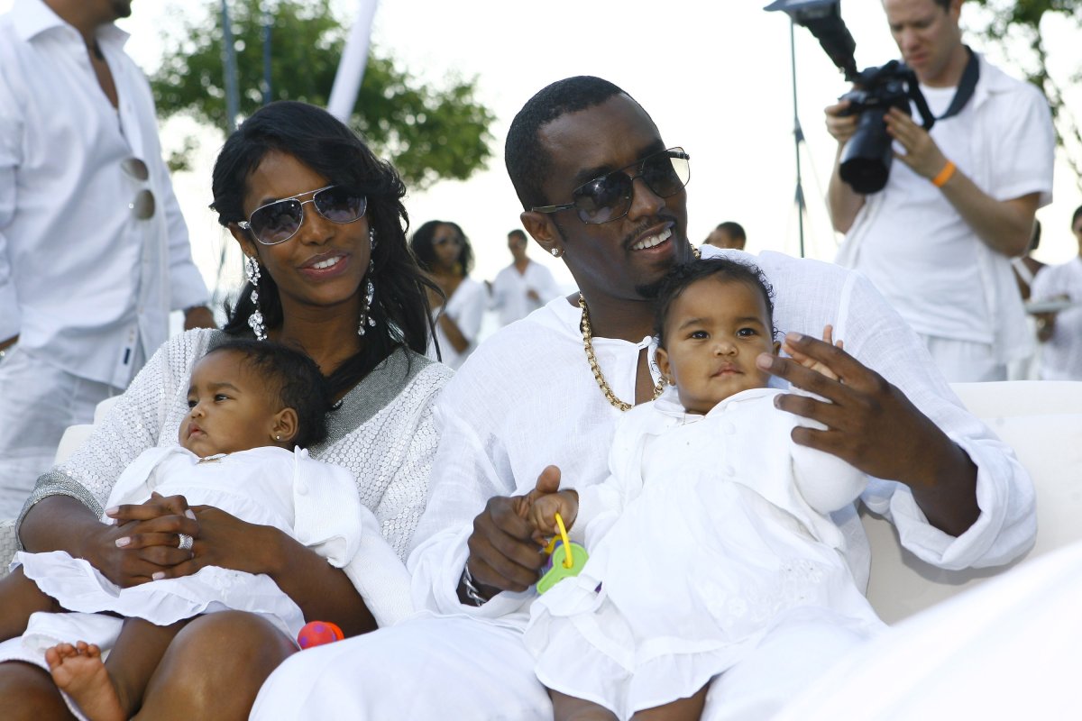 Sean "Diddy" Combs and Kim Porter with their twin daughters D'Lila Star Combs and Jessie James Combs pictured at "The Real White Party" presented by Combs at the family's East Hampton estate on Sept. 2, 2007 in East Hampton, N.Y.