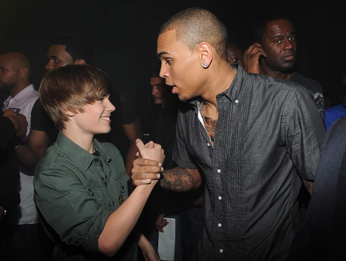 (L-R) Justin Bieber and Chris Brown pose backstage at the BET-SOS Saving Ourselves Help for Haiti Benefit Concert at AmericanAirlines Arena on Feb. 5, 2010, in Miami, Fla.