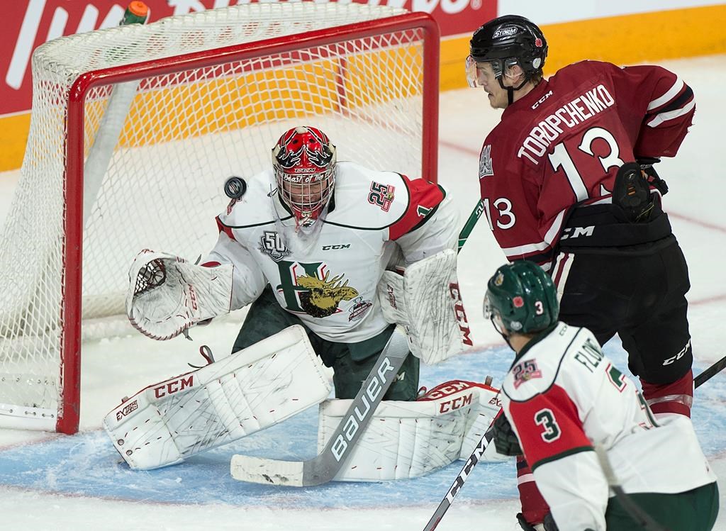 Halifax Mooseheads goaltender Alex Gravel stops Guelph Storm Alexey Toropchenko, right, in first period 2019 Memorial Cup action in Halifax on Sunday, May 19, 2019.