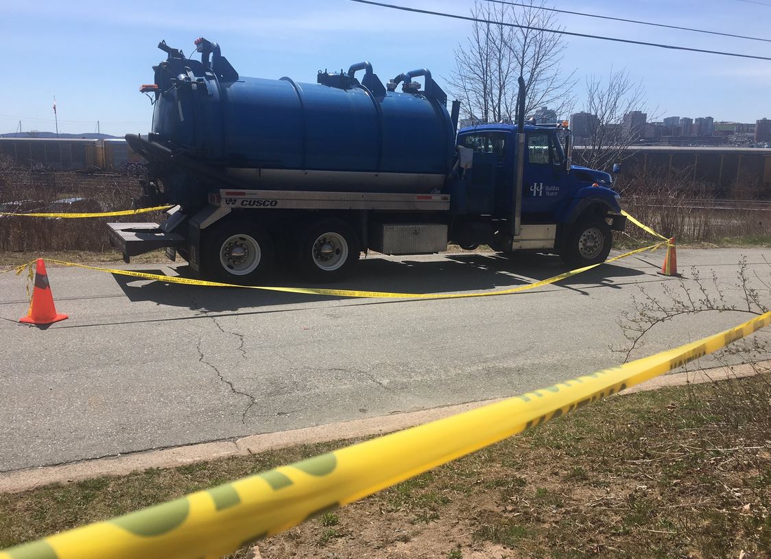 Police say a woman was sent to hospital with life-threatening injuries following a collision with a Halifax Water truck. 