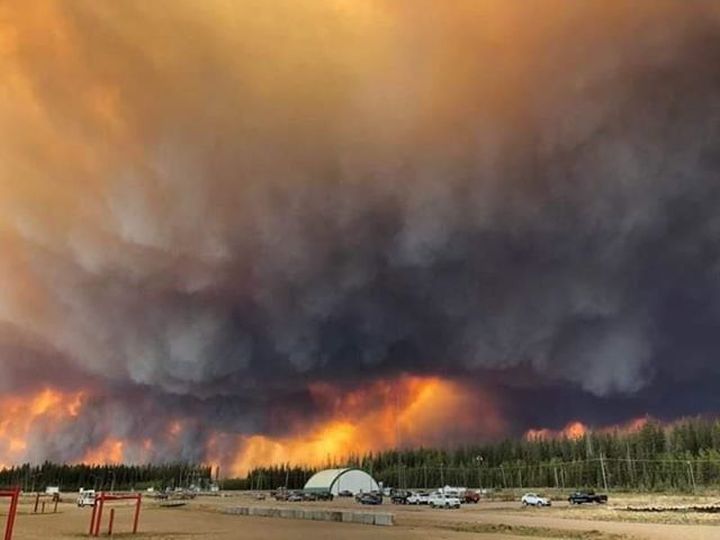 A wildfire burns near High Level on Sunday, May 19, 2019, near the Norbord jobsite.