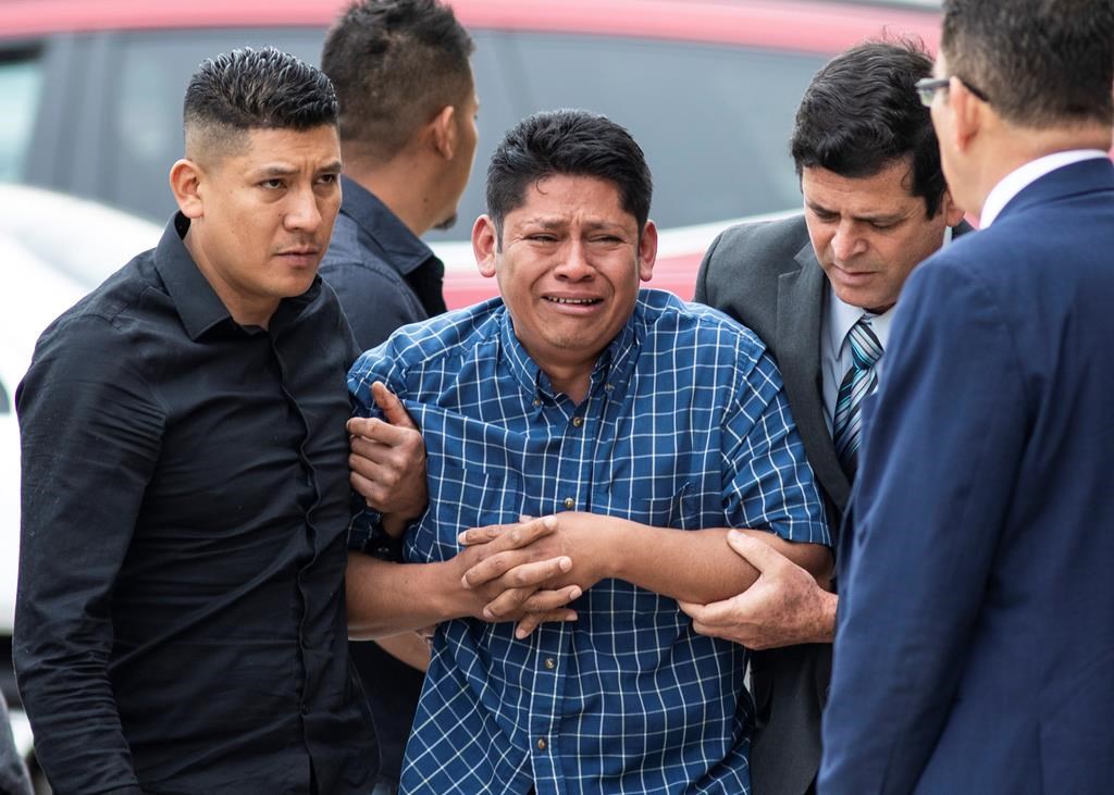 Arnulfo Ochoa, the father of Marlen Ochoa-Lopez, is surrounded by family members and supporters, as he walks into the Cook County medical examiner’s office to identify his daughter’s body, Thursday, May 16, 2019 in Chicago. (Ashlee Rezin/Chicago Sun-Times via AP)