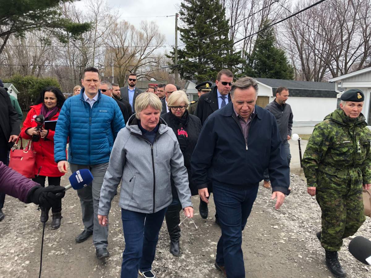 Quebec Premier Francois Legault tours Sainte-Marthe-sur-le-Lac on Thursday .