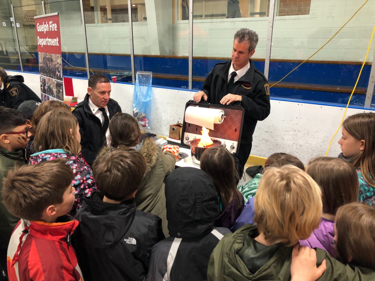 Students learn about stove-top fire safety from members of the Guelph Fire Department at Emergency Preparedness Day 2019.