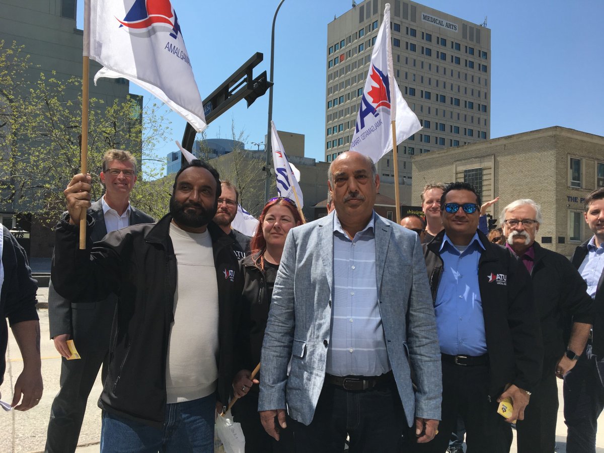 The president of Winnipeg's transit union, Aleem Chaudhary standing with members of his union promoting the union's job action scheduled for Tuesday May 13th, 2019.