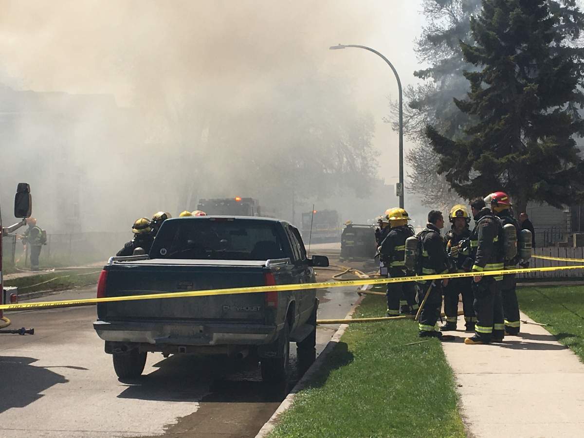 Firefighters on Young street fighting a fire that spread to six different houses.