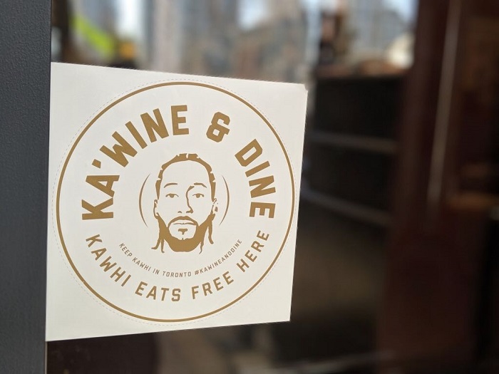 Ka’wine & Dine sticker on the door of a restaurant who joined in on the campaign.