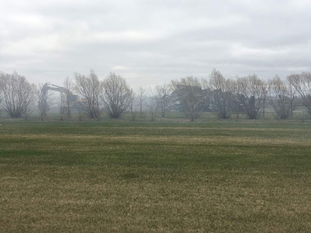 Smoke and a pile of material are all that’s left of the Dixon’s chicken barn