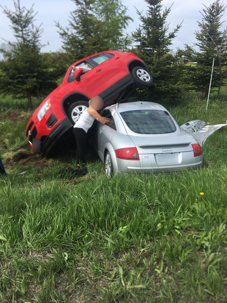 An individual who reported erratic driving to police before the crash happened took this photo of a bystander at the scene. 