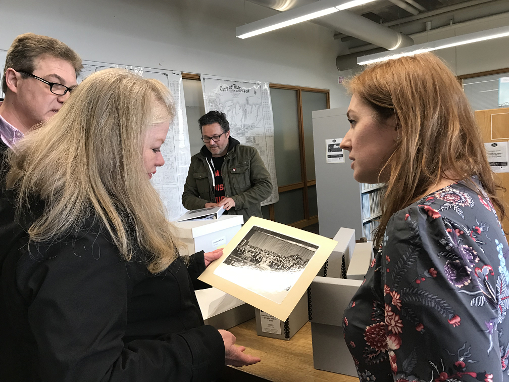 Susan Chambers-Stothart shows HPL's director of local history & archives Karen Milligan a photo from the collection that includes her mother.