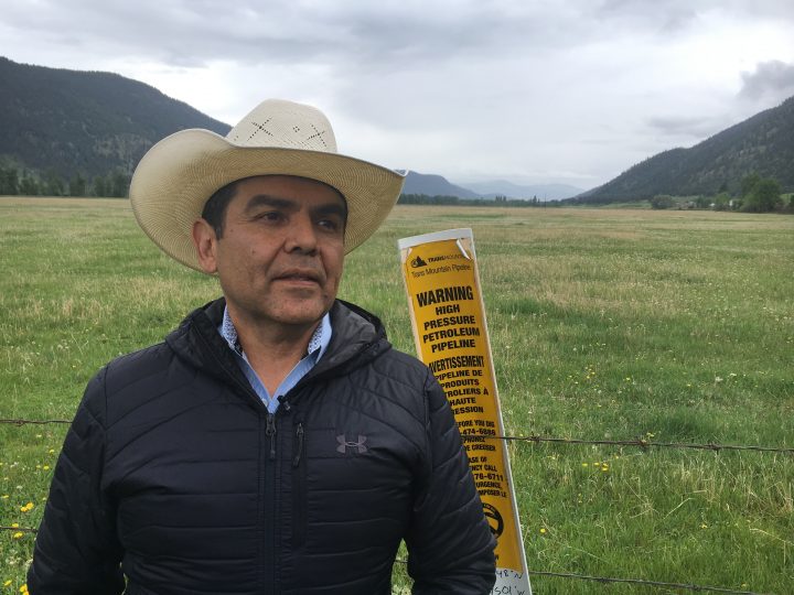 Chief Michael Lebourdais stands along above the Trans Mountain pipeline as it runs through the Whispering Pines first nation near Kamloops, BC .