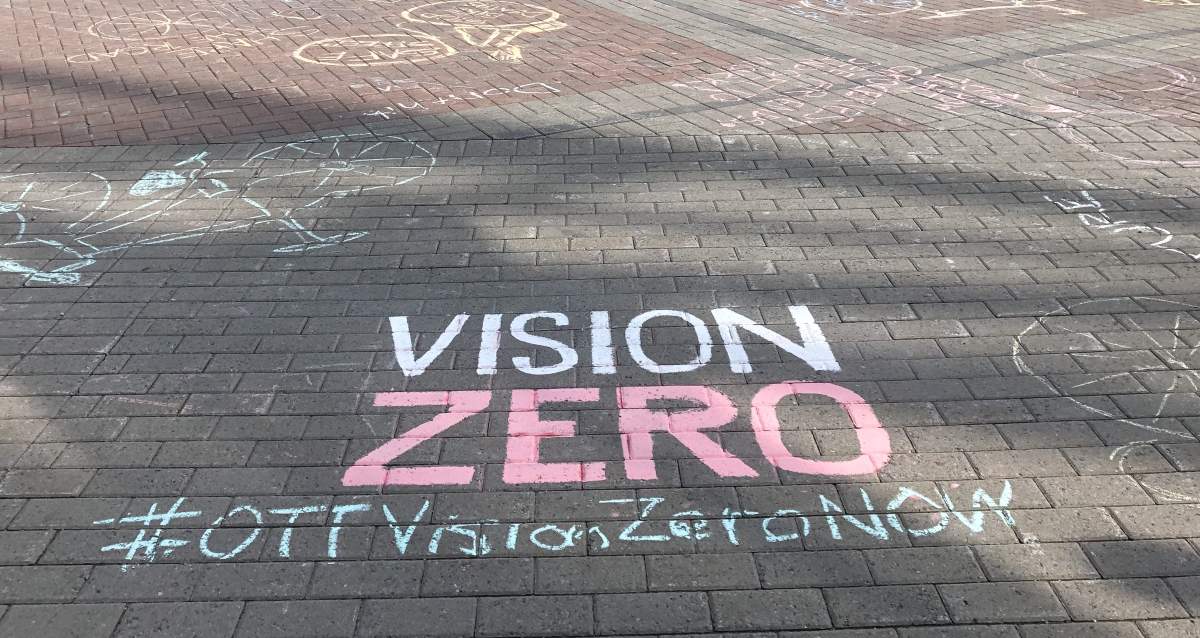 Chalk writings adorn the square outside Marion Dewar Plaza at Ottawa city hall. They were written by over 200 cyclists that rode down Laurier Avenue on May 22, 2019, calling for safer cycling infrastructure in Ottawa.