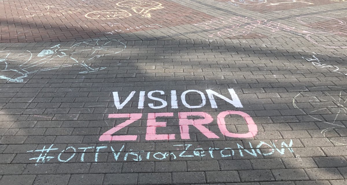 Chalk writings adorn the square outside Marion Dewar Plaza at Ottawa city hall. They were written by over 200 cyclists that rode down Laurier Avenue on May 22, 2019, calling for safer cycling infrastructure in Ottawa.