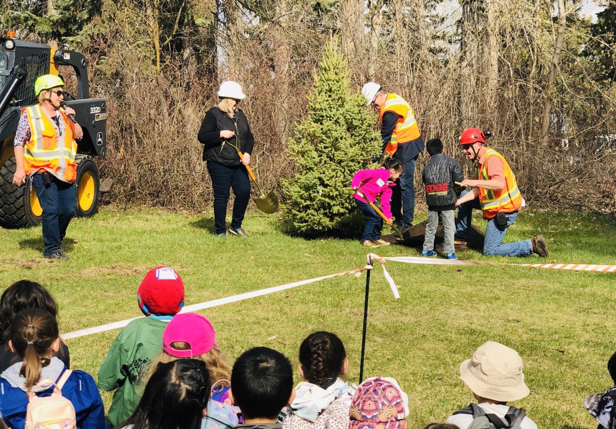 Students participating in the ceremonial tree planting at Arbor Day in Whitemud Park.