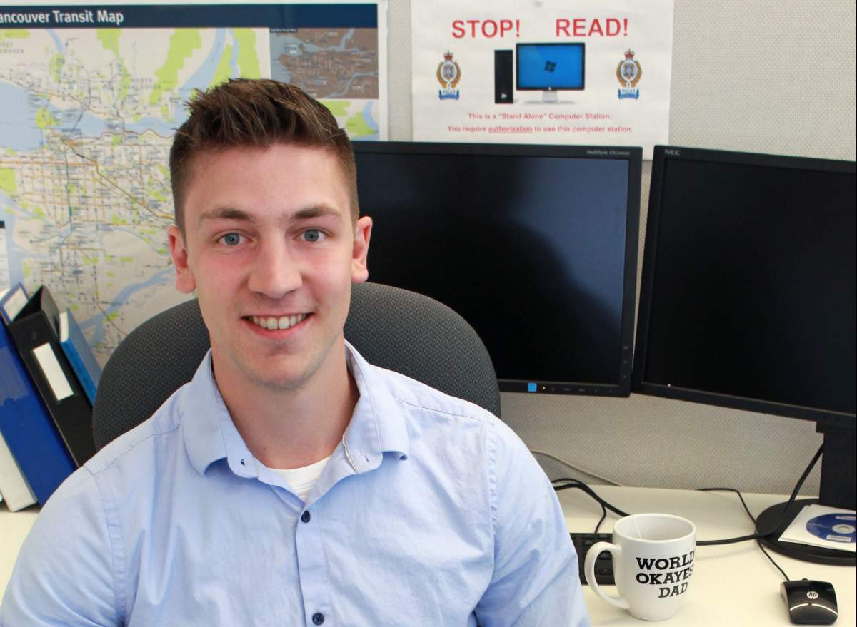 Metro Vancouver Transit Police Const. Josh Harms seen back at his desk in New Westminster Tuesday, May 7, 2019. Harms was shot in the line of duty at Scott Road SkyTrain station in Surrey on Jan. 30, 2019.