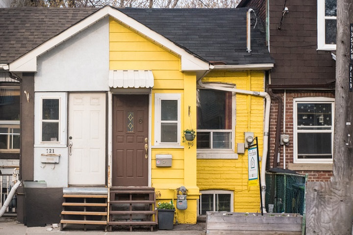 The house featured in the video "Li'l Yellow House," which is located at 119 Coxwell Ave.