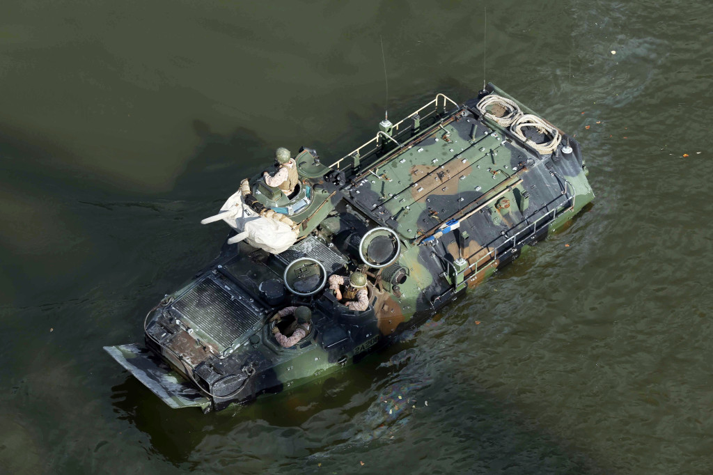 This Sept. 6, 2016, photo released by the U.S. Marine Corps shows Marines with the 2nd Amphibious Assault Battalion aboard AAV-7 Amphibious Assault Vehicles during an exercise on the Cumberland River in Nashville, Tenn.