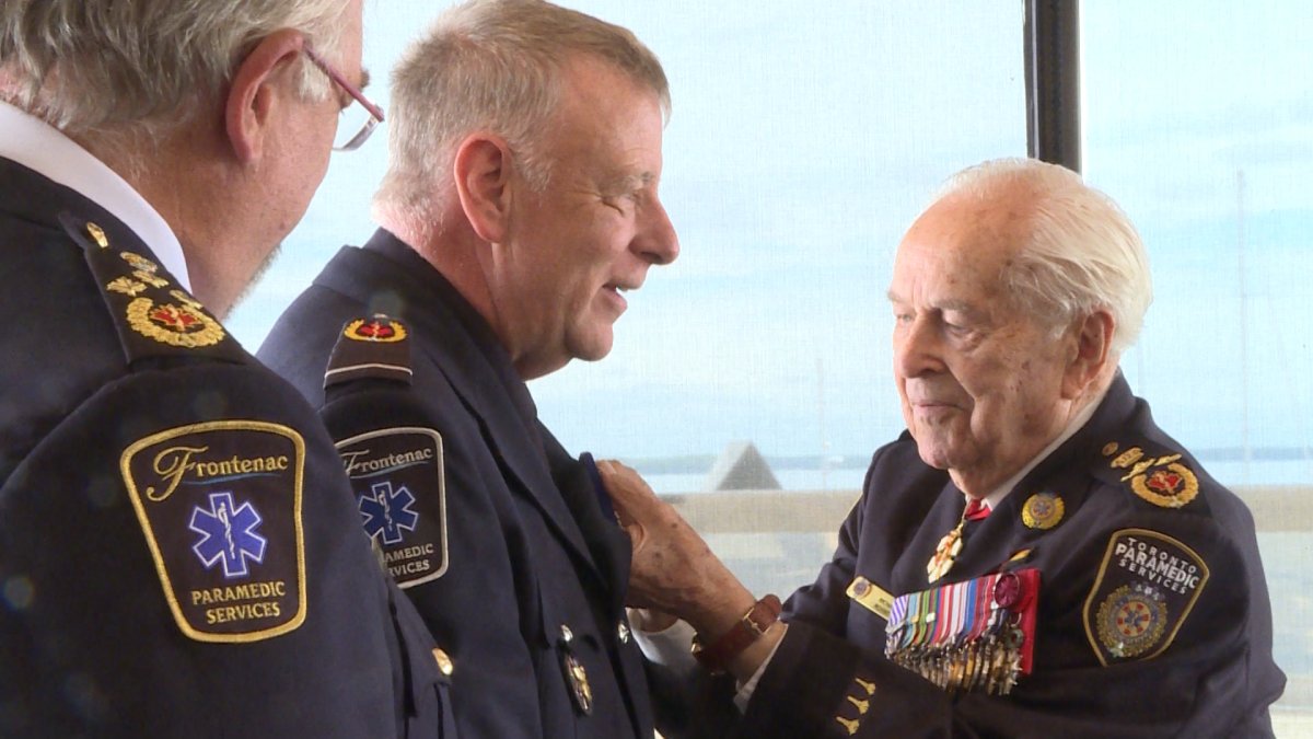 Dale Hodgins receives medal from honorary Lt.-Gen. Richard Rohmer in Kingston, Ont.