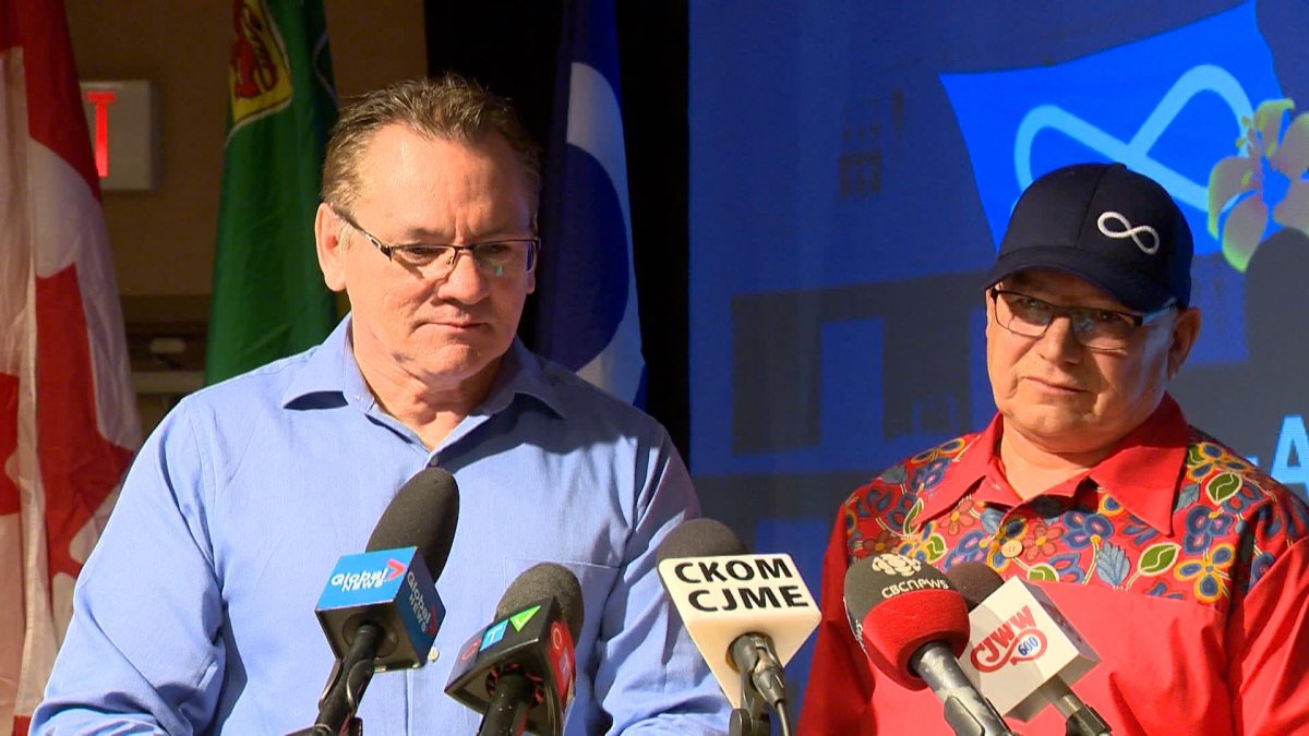 Leonard Montgrand (left) and MN-S president Glen McCallum announce an MOU with the Canadian government to reach a settlement for Île-à-la-Crosse Boarding School survivors.