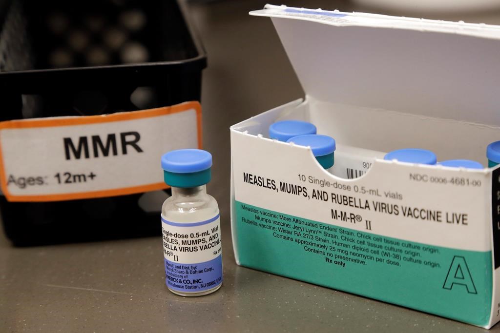 FILE - This May 15, 2019 file photo shows a vial of a measles, mumps and rubella vaccine at a clinic in Vashon Island, Wash. On Thursday, May 30, 2019,.
