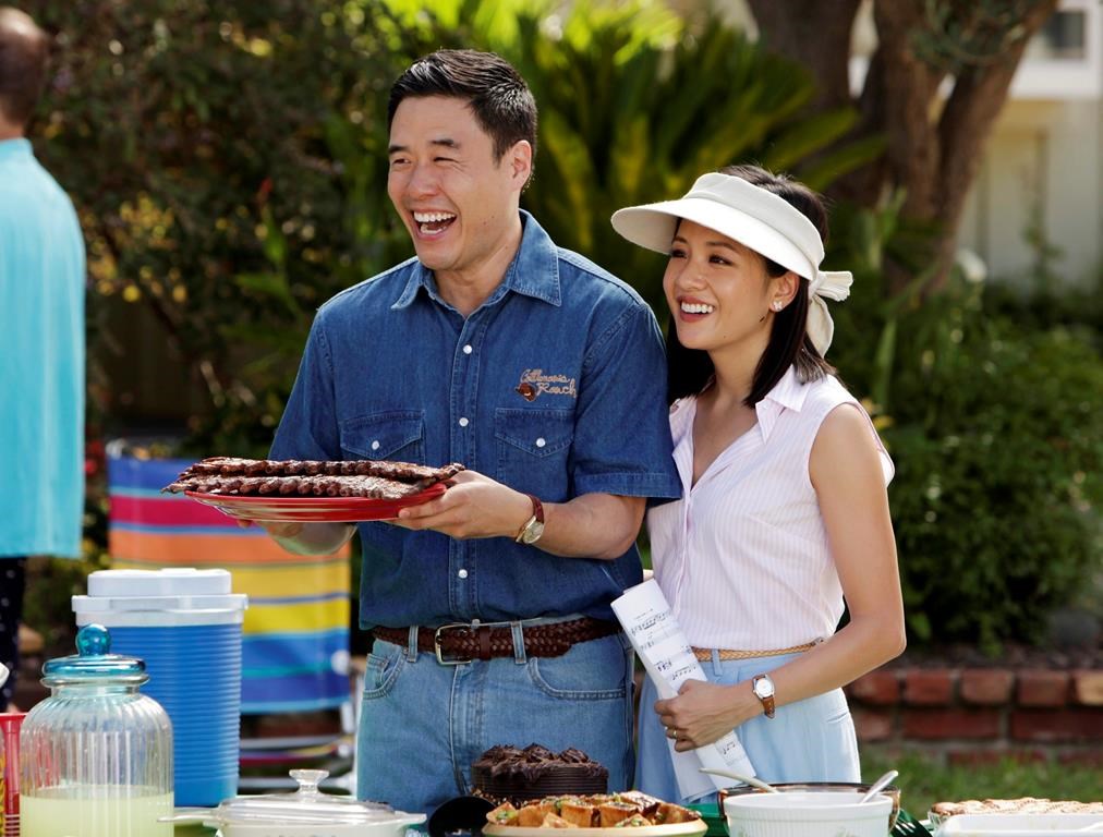 Randall Park, left, and Constance Wu appear in a scene from the new comedy series 'Fresh off the Boat.'.