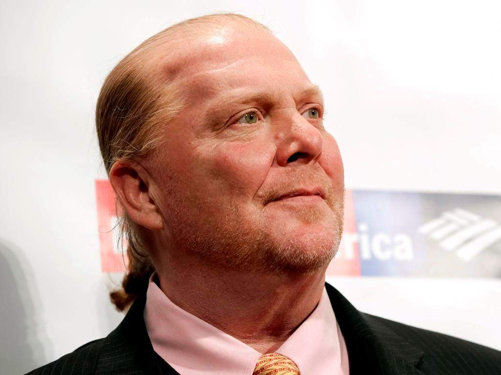FILE - In this Wednesday, April 19, 2017, file photo, chef Mario Batali attends an awards event in New York. The Suffolk County District Attorney‚Äôs Office in Boston says Batali is scheduled to be arraigned Friday, May 24, 2019, on a charge of indecent assault and battery, in connection with an allegation that he forcibly kissed and groped a woman at a Boston restaurant in 2017.