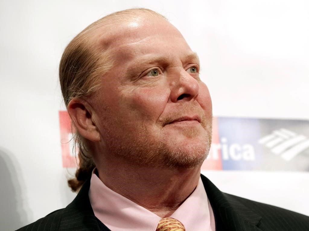 FILE - In this Wednesday, April 19, 2017, file photo, chef Mario Batali attends an awards event in New York. The Suffolk County District Attorney‚Äôs Office in Boston says Batali is scheduled to be arraigned Friday, May 24, 2019, on a charge of indecent assault and battery, in connection with an allegation that he forcibly kissed and groped a woman at a Boston restaurant in 2017.