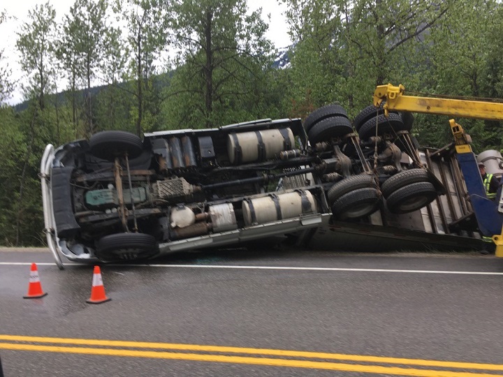 A semi is on its side, approximately two kilometres west of Three Valley Gap on the Trans-Canada Highway.